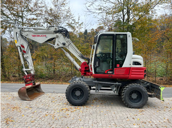 Колёсный экскаватор TAKEUCHI